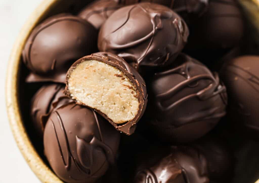 Chocolate peanut butter balls in a bowl.