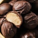 Chocolate peanut butter balls in a bowl.