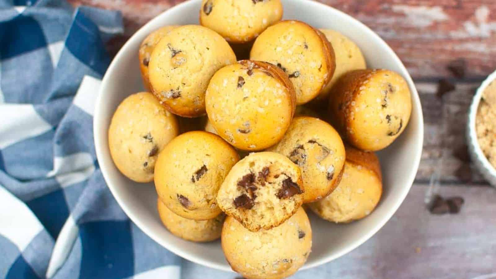 Chocolate chip sourdough discard muffins in a white bowl.