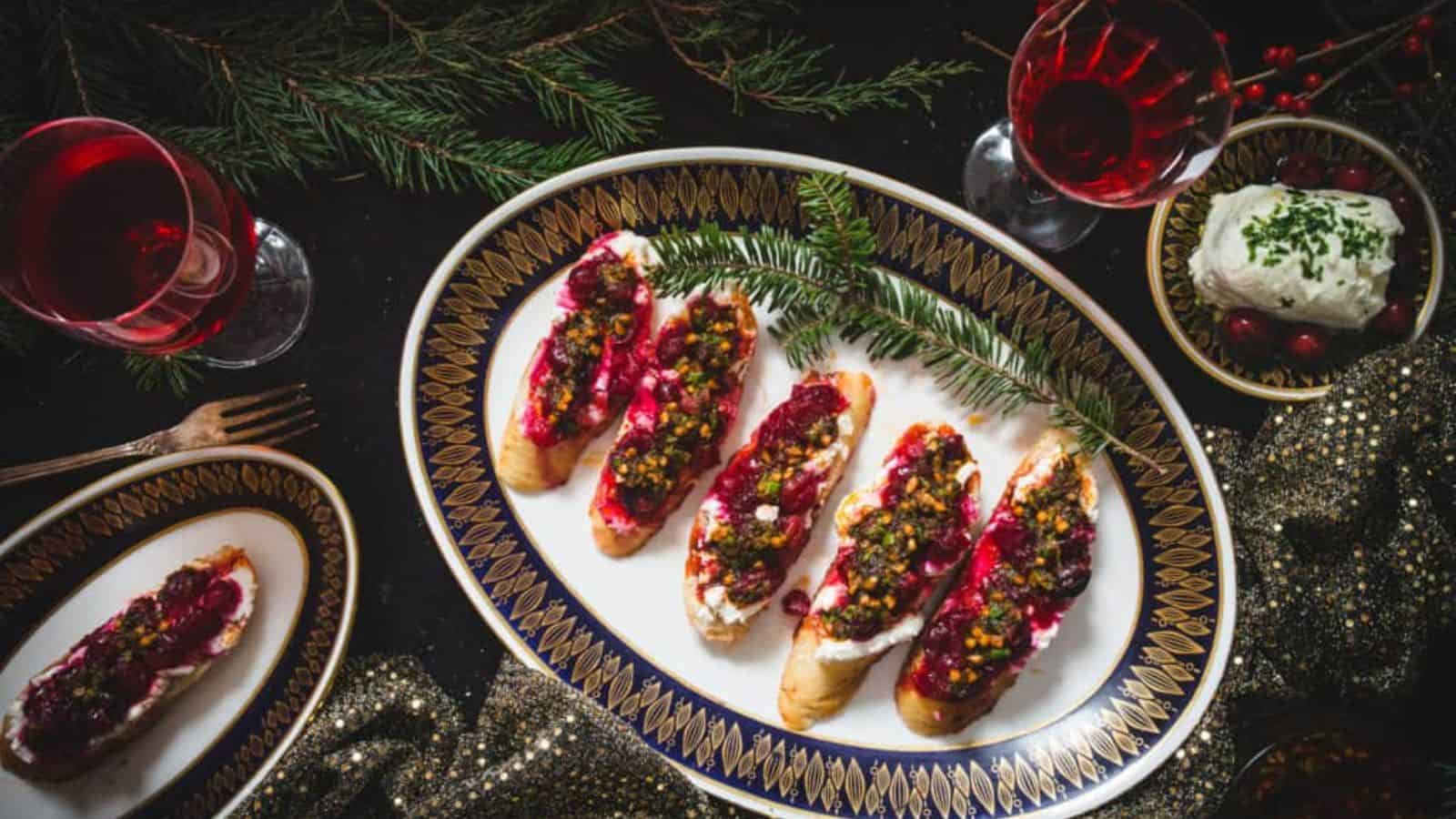 Cranberry and pistachio crostini on a plate.