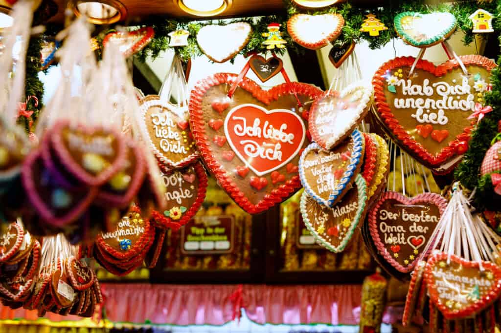 A display of heart shaped cookies hanging from the ceiling at German Christmas Markets.