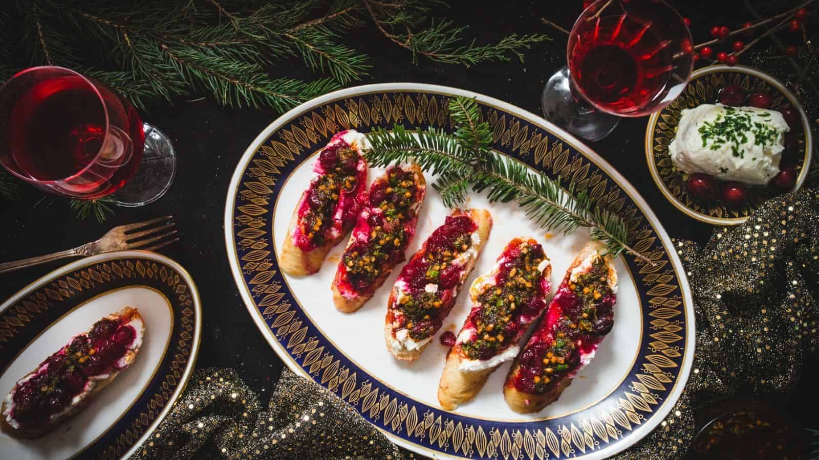 Cranberry bruschetta with pistachios and cranberries on a plate.