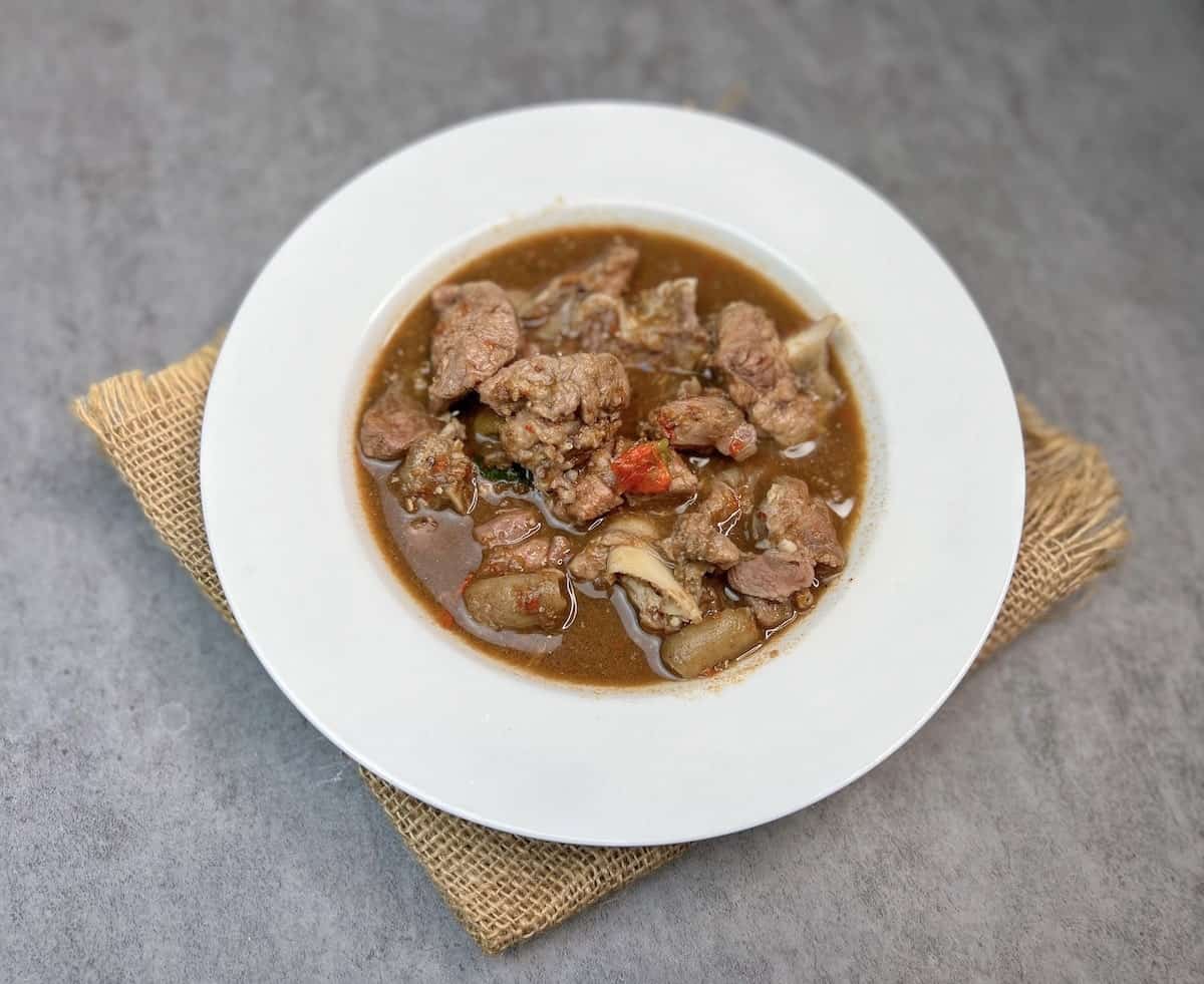 Close-up view of Nigerian Pepper Soup, a traditional remedy known for its medicinal properties and ability to comfort when feeling sick.