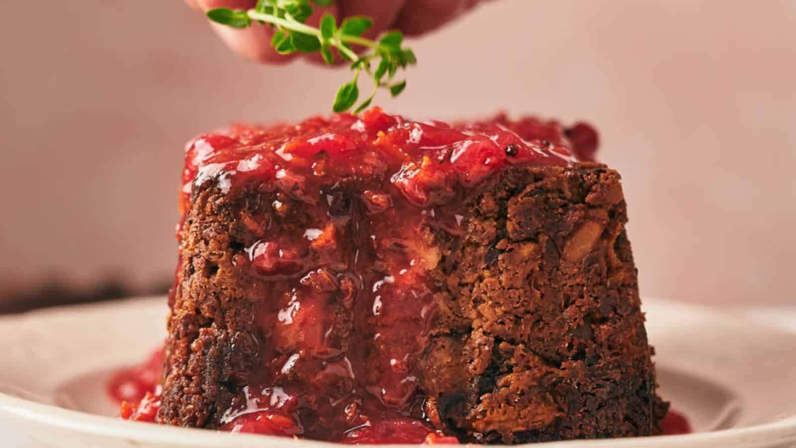 Nut roast with cranberry sauce on a plate.