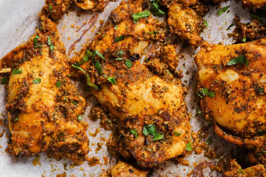 Pollo asado on a baking sheet.