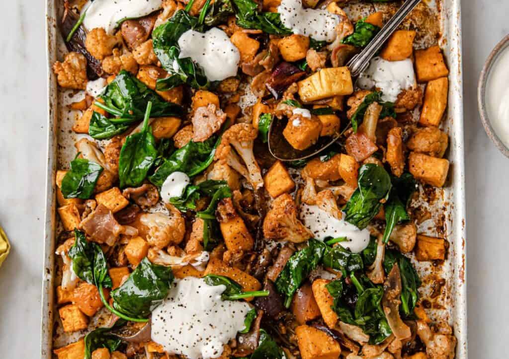 Roasted cubed butternut squash and spinach with sour cream.