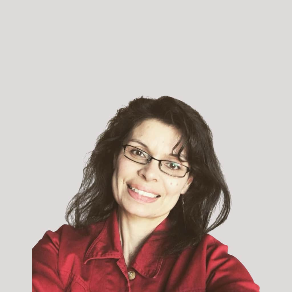 A woman wearing glasses and a red jacket.