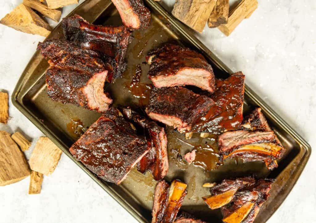 Bbq ribs on a baking sheet.