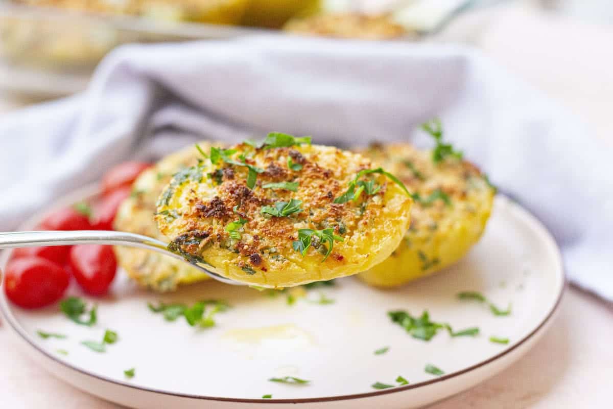 A plate of TikTok Parmesan Potatoes, golden-brown and crispy, perfect for a creative and delicious school lunch side dish.