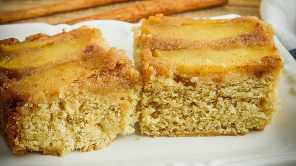 A slice of apple cinnamon coffee cake on a plate.