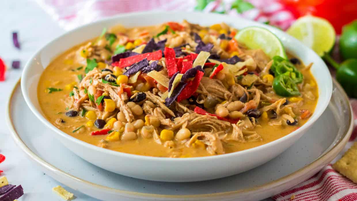 Mexican chicken tortilla soup in a white bowl.