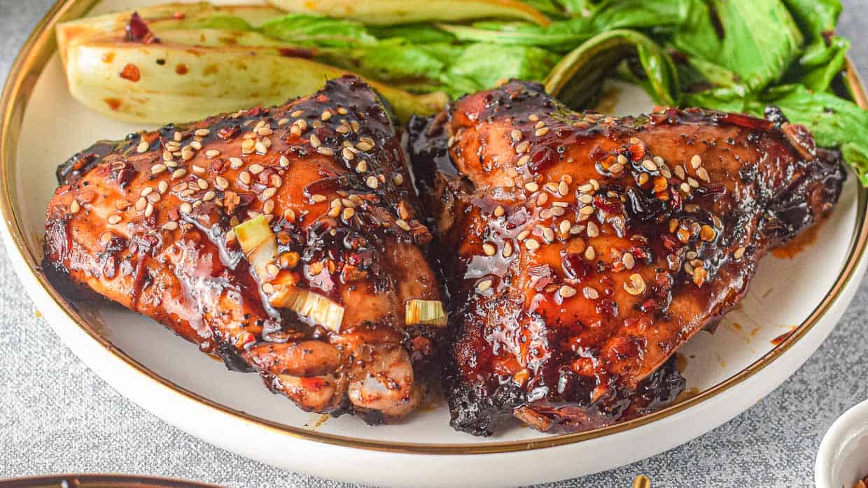 Asian chicken with sesame seeds on a plate.