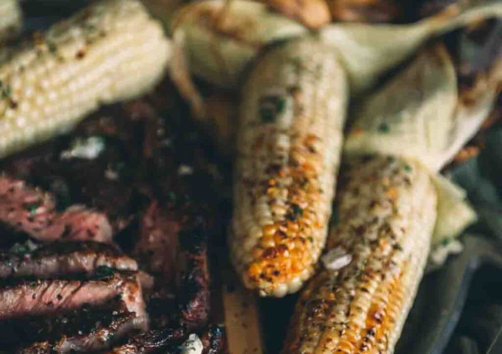 Grilled steak and corn on the cob.