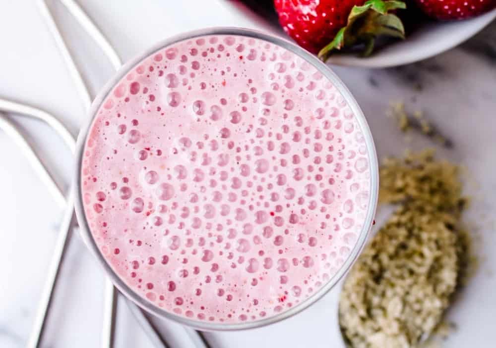 Overhead image of a strawberry smoothie.