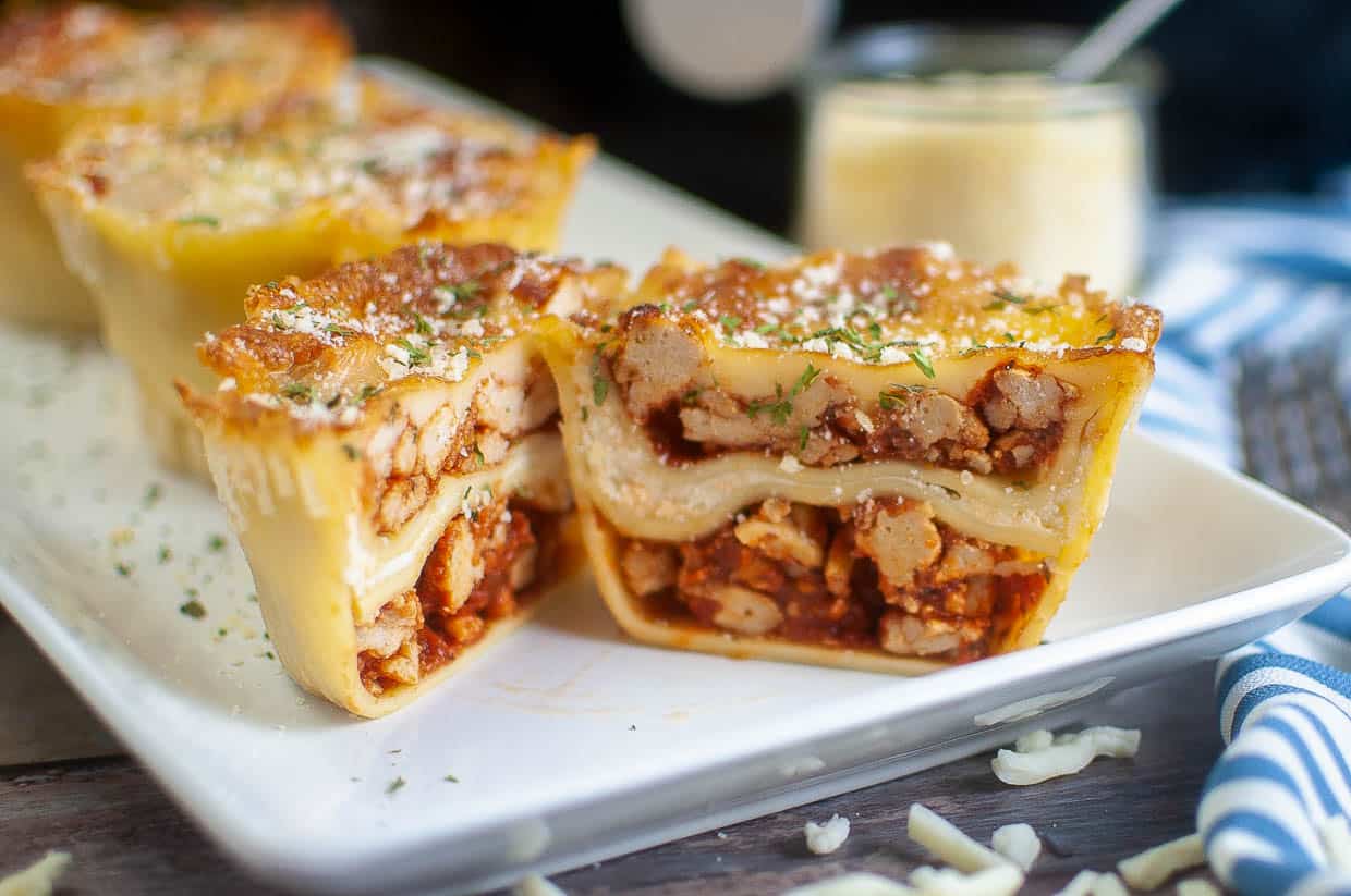 Mini lasagna cups cut open to show the insides.