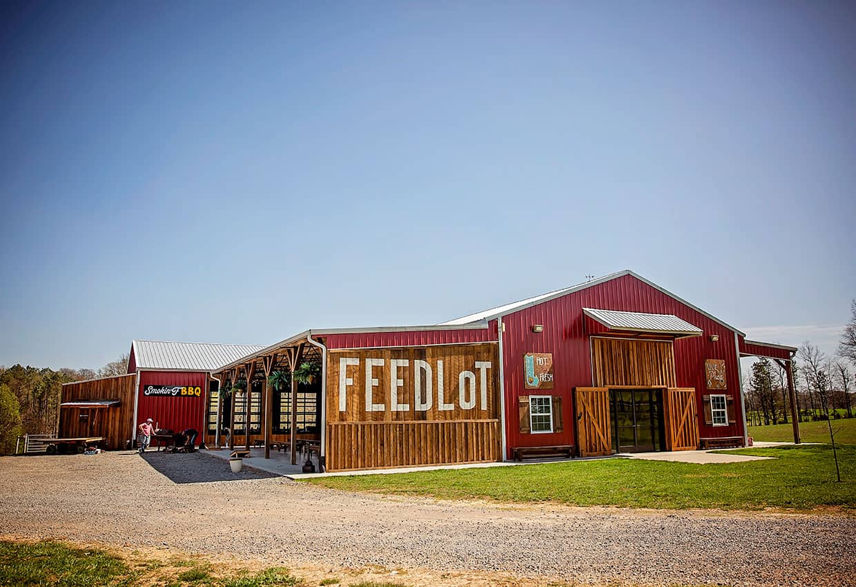 A red building in Loudon County with a sign that says feedlot.