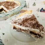 A slice of chocolate cream pie on a plate.