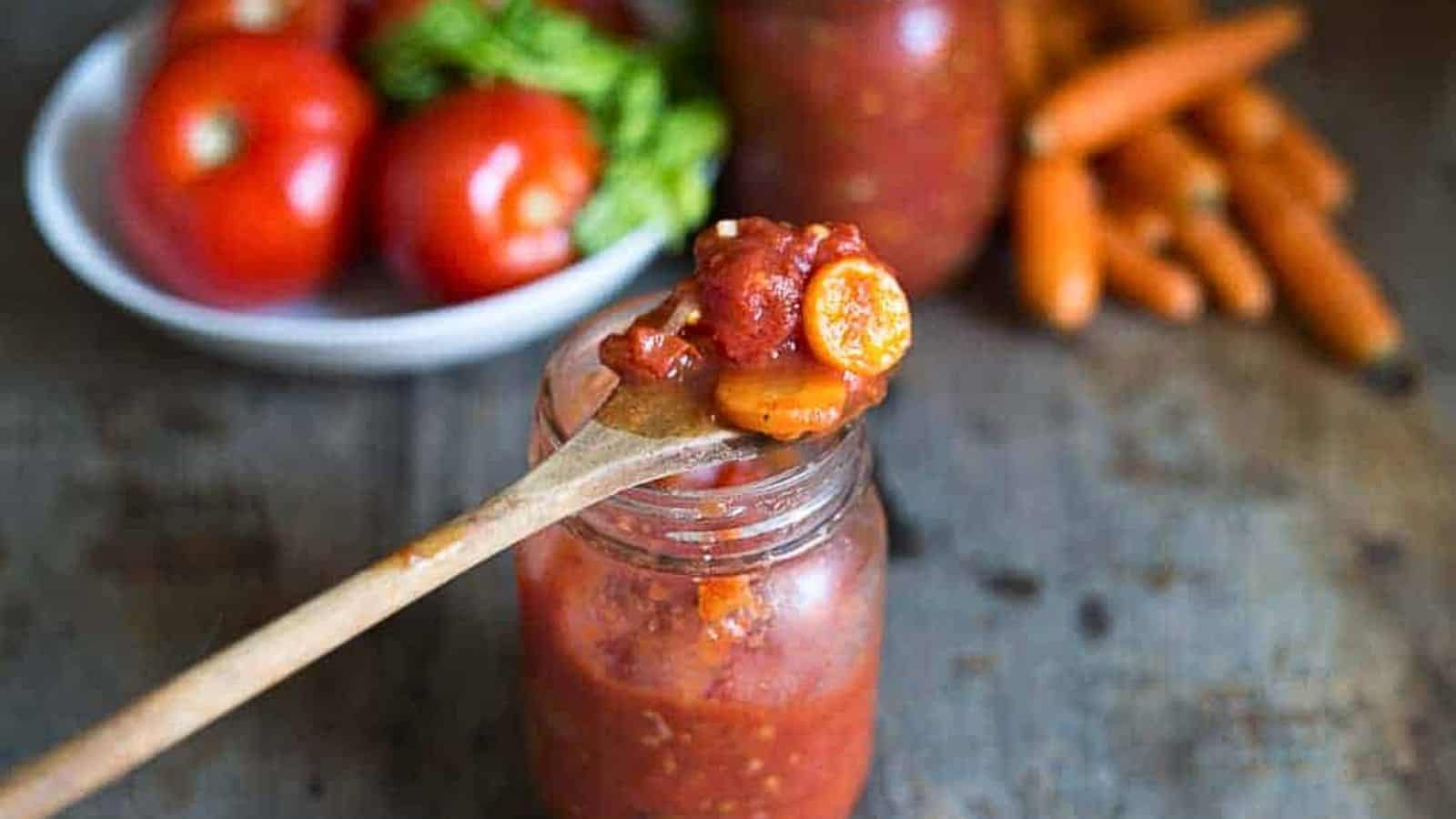 Tomato sauce in a jar with carrots and tomatoes.