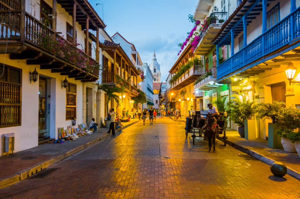 A street lined with buildings at dusk in cartagena, colombia.