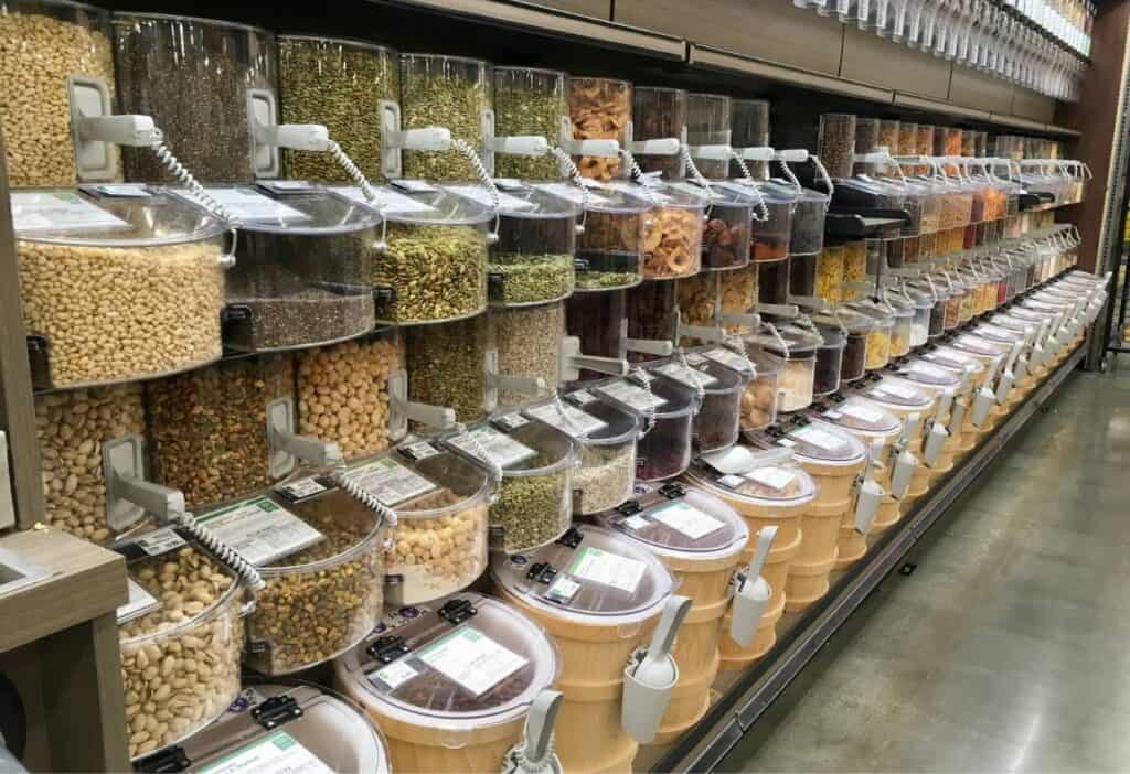A row of containers filled with different kinds of food.