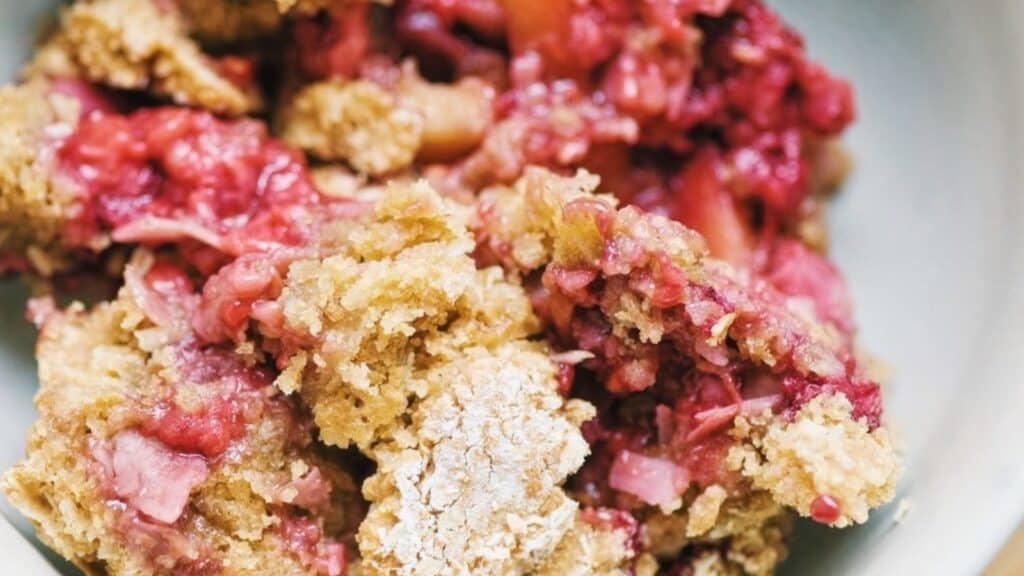 A close up of a bowl of berry crumble.