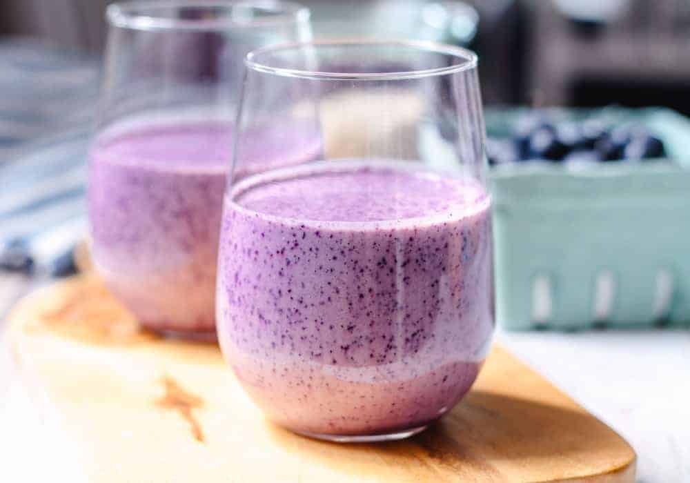A glass of blueberry oatmeal smoothie.