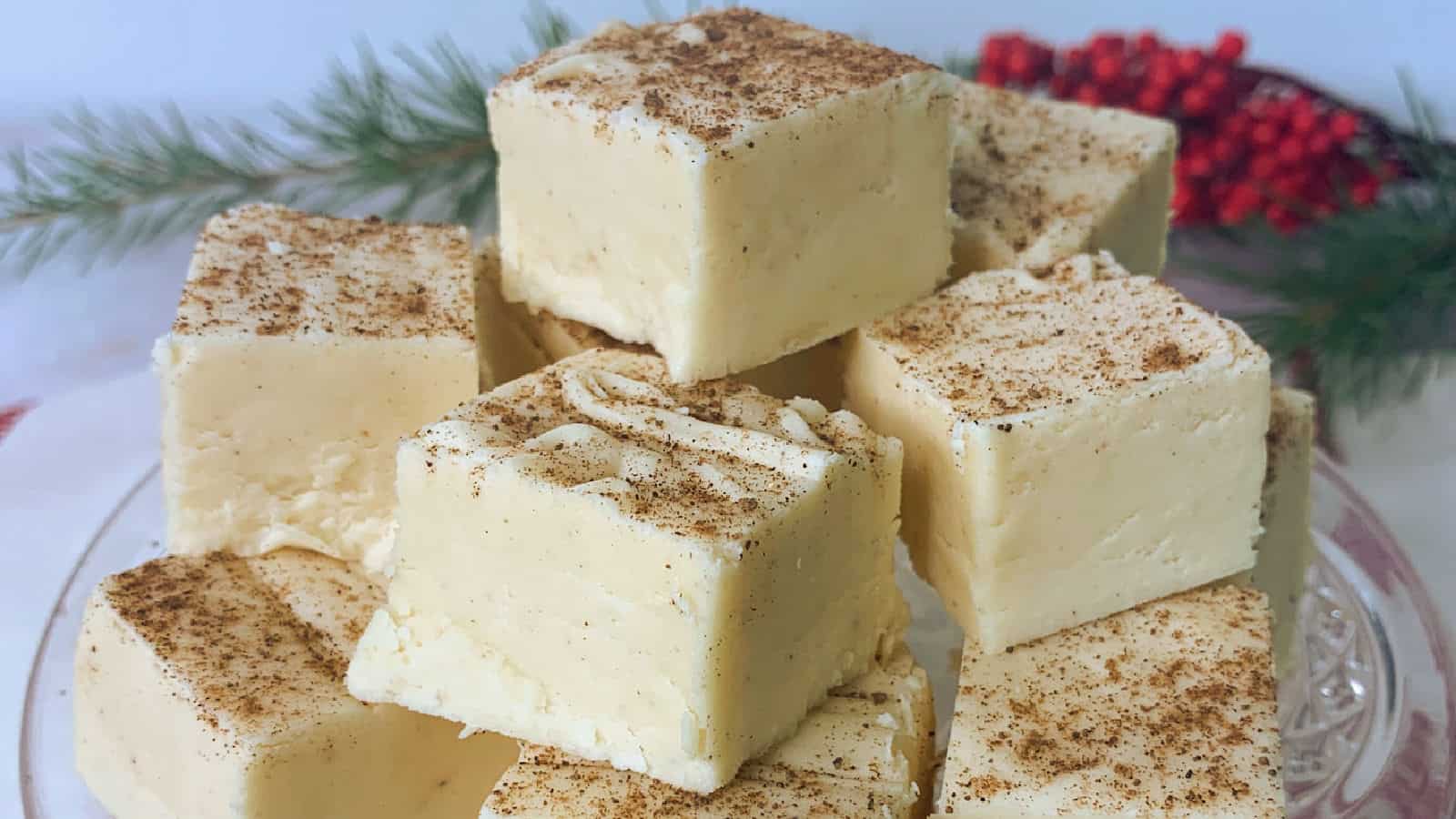 A stack of eggnog fudge on a plate.