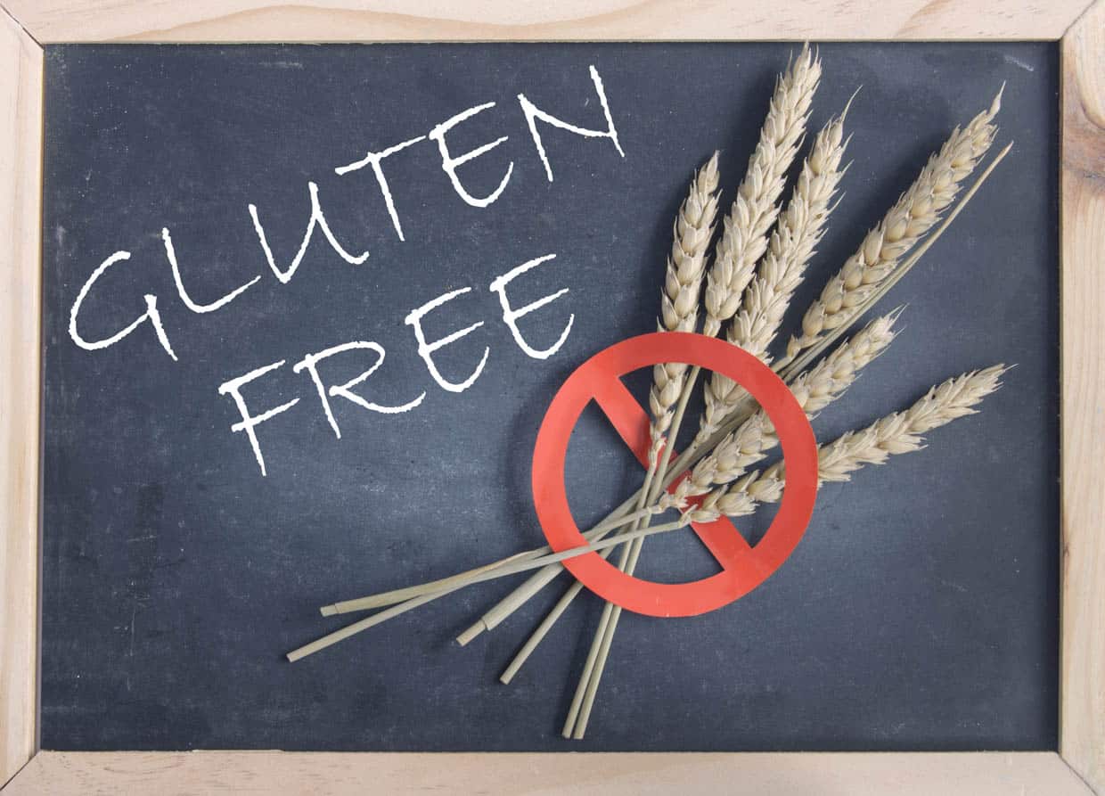 A chalkboard with wheat and a sign that says gluten free.