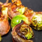 Bacon wrapped brussels sprouts on skewers.