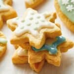 A group of cookies decorated with icing and snowflakes.