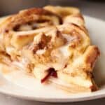 A slice of apple cinnamon roll on a plate.