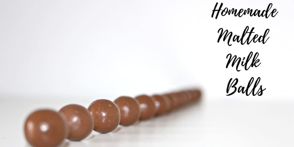 Malted Milk Balls lined up in a line.