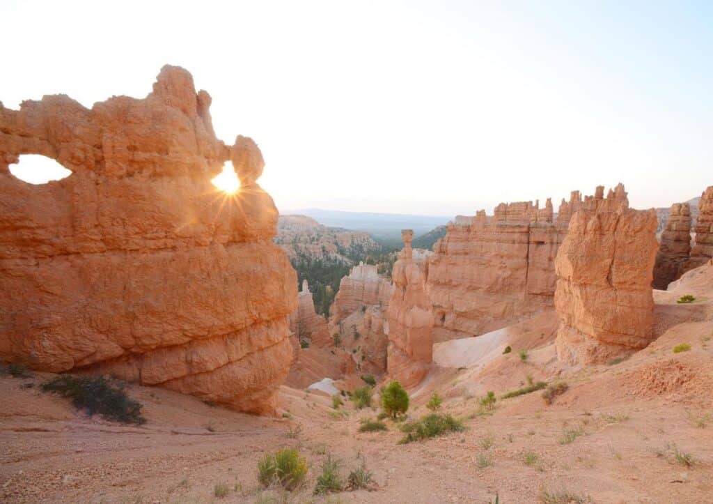 The sun peeks through a hole in a hoodoo at Bryce Canyon National Park in Utah.