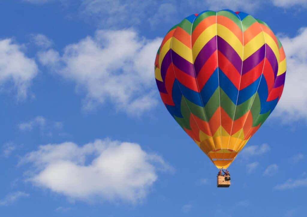 A colorful hot air balloon floating gracefully in the sky.