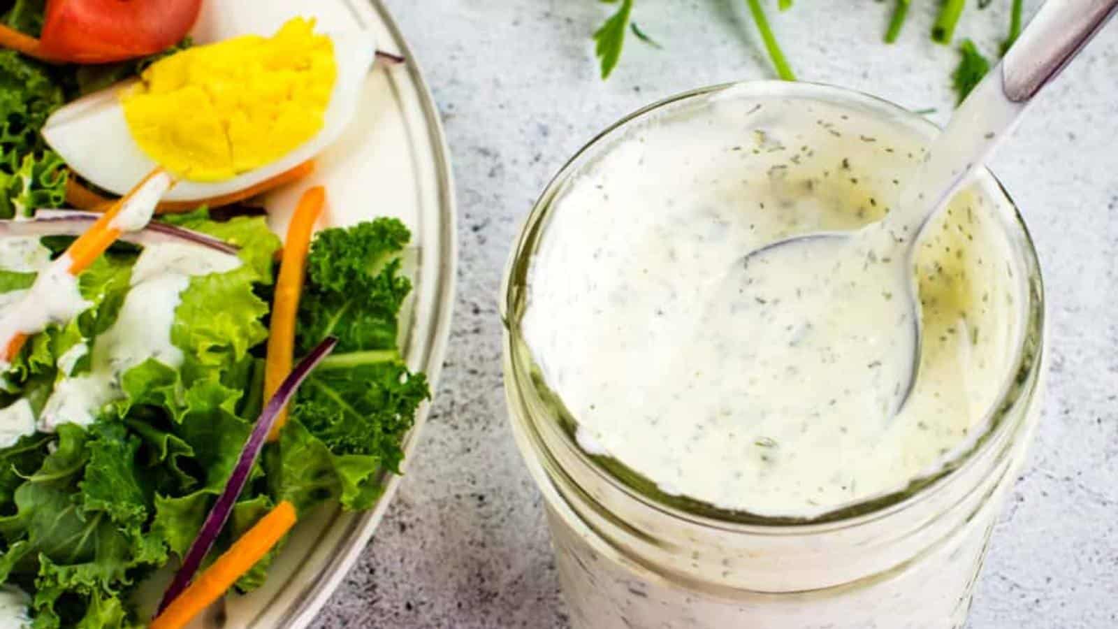 Dill pickle dressing in a jar with an egg on top.