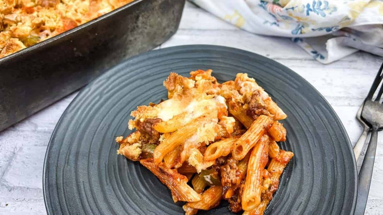 A serving of Sloppy Joe Casserole pasta with meat on a plate with a fork.