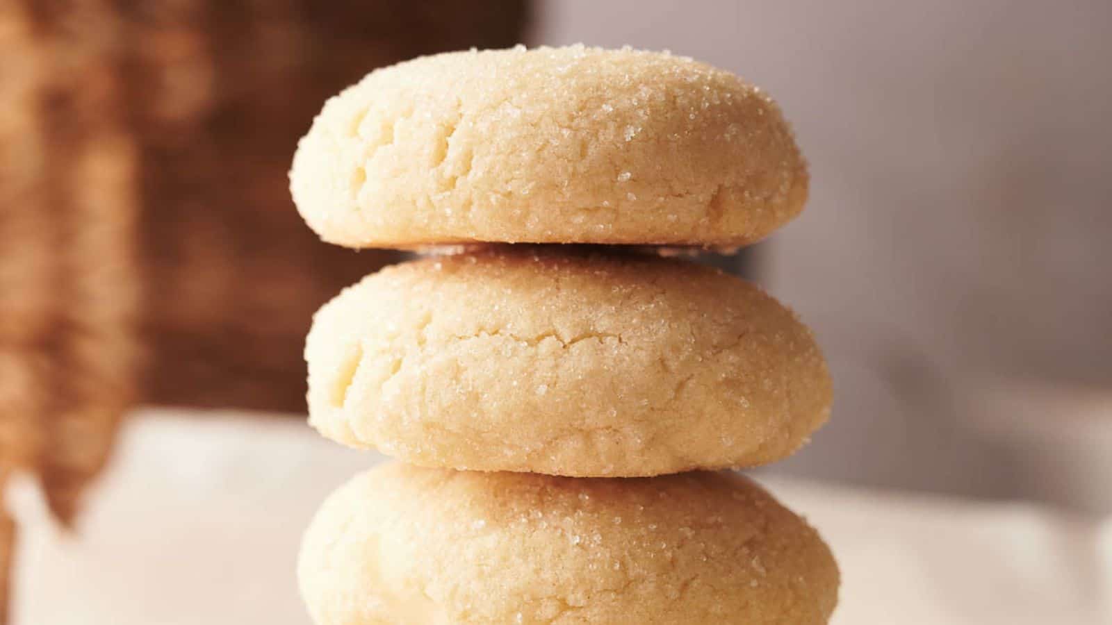 Three sugar cookies stacked on top of each other.