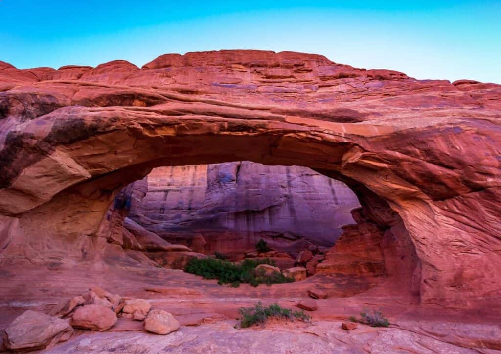 A red rock arch in Arches National Park in Utah.