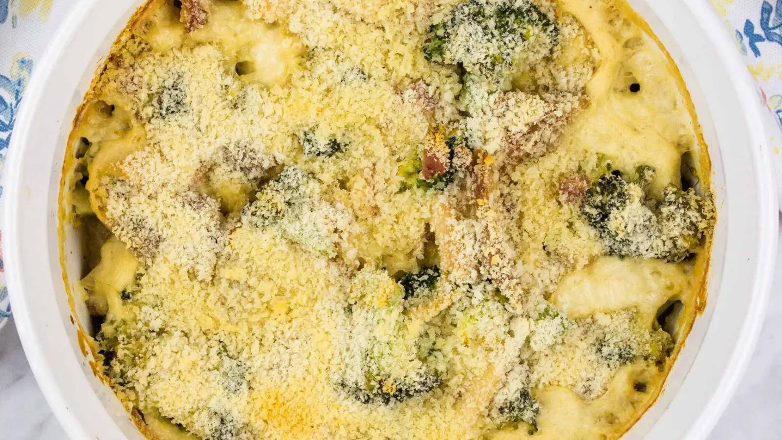 A casserole dish with broccoli and turkey.