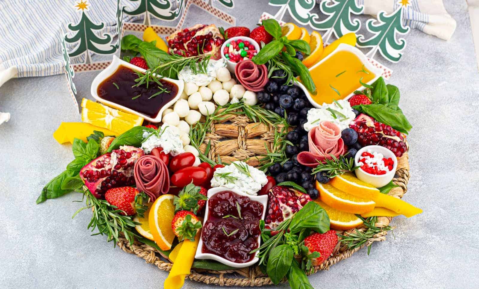 A Christmas wreath charcuterie board displayed on a table.