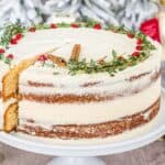 A christmas cake with a slice taken out of it.