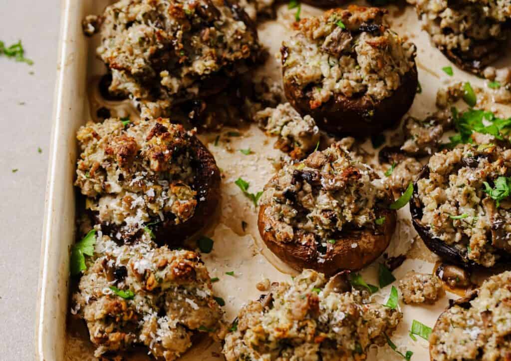 Sausage stuffed mushrooms on a serving tray.