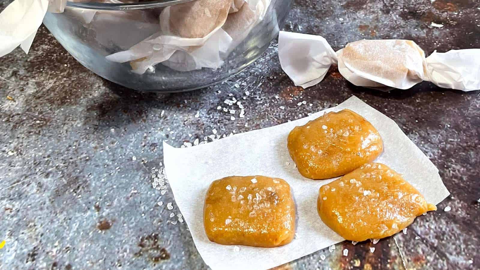 A jar of sea salted caramels sitting on top of a piece of paper.