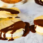 Ice cream sandwiches with chocolate drizzle.