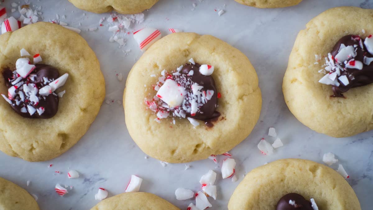 Candy cane cookies with chocolate and peppermint sprinkles.
