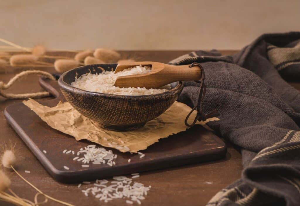 Rice in a bowl on a wooden table.