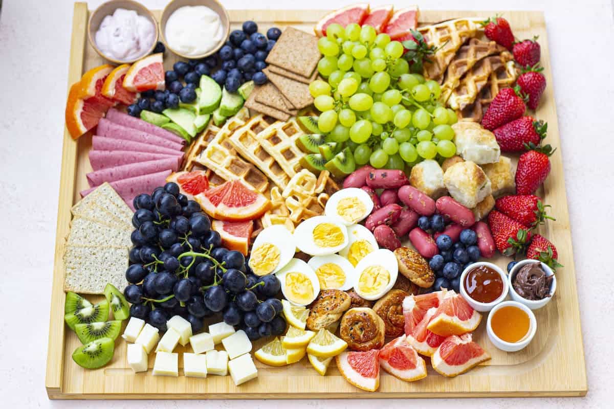 A wooden board with fruits on it.
