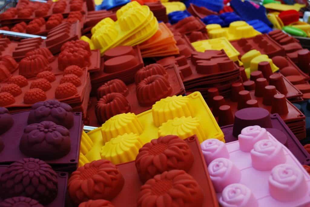 Several colorful silicone cake molds.