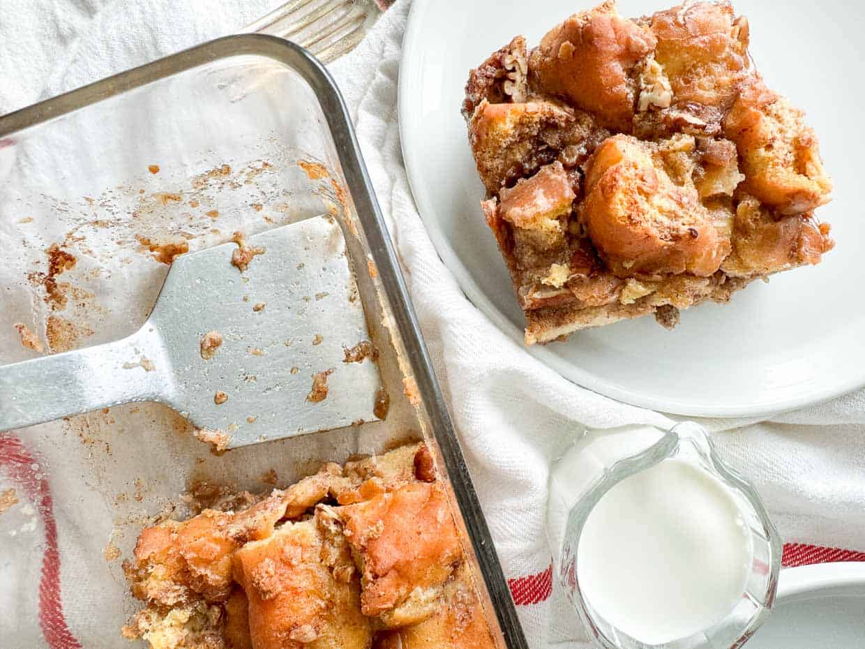 Donut bread pudding on a plate and in a baking dish.
