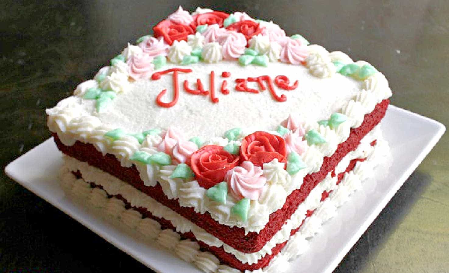 A red velvet cake on a white plate.